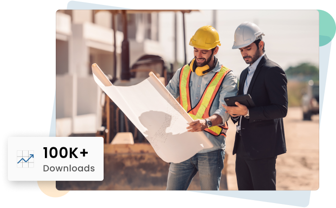 Construction workers reviewing blueprints